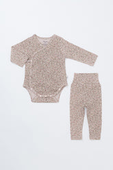 Selina Babysuit Iris front view – a comfortable newborn cotton bodysuit in a soothing iris tone with secure snap closures